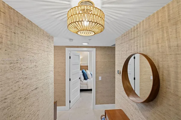a view of a bathroom with a sink and a mirror