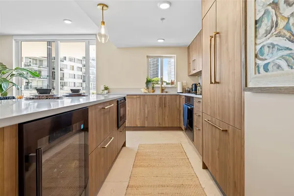 a kitchen with stainless steel appliances granite countertop counter space a sink and a window