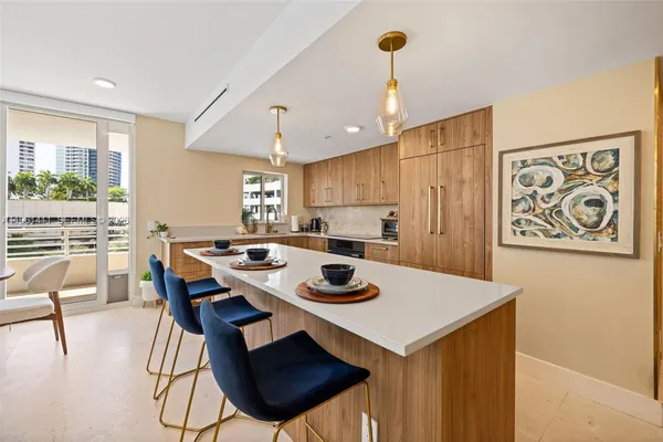 a kitchen with a table and chairs in it