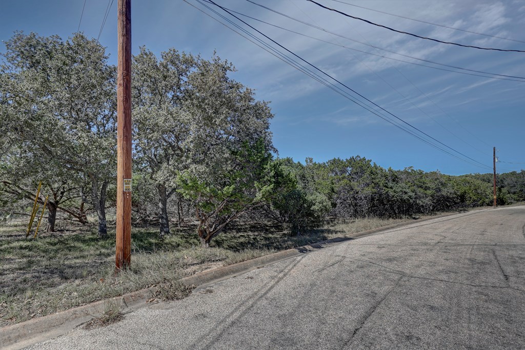 506 Sumack, Unit 11 Kerrville, TX 78028 - Photo 2 of 12 a backyard of a house with lots of green space