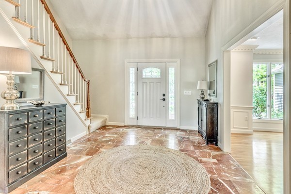 42 Phillips Road Sudbury, MA 01776 - Photo 5 of 28 a view of an entryway with wooden floor and a livingroom