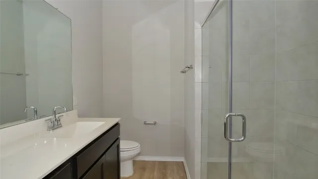 a bathroom with a sink toilet and vanity