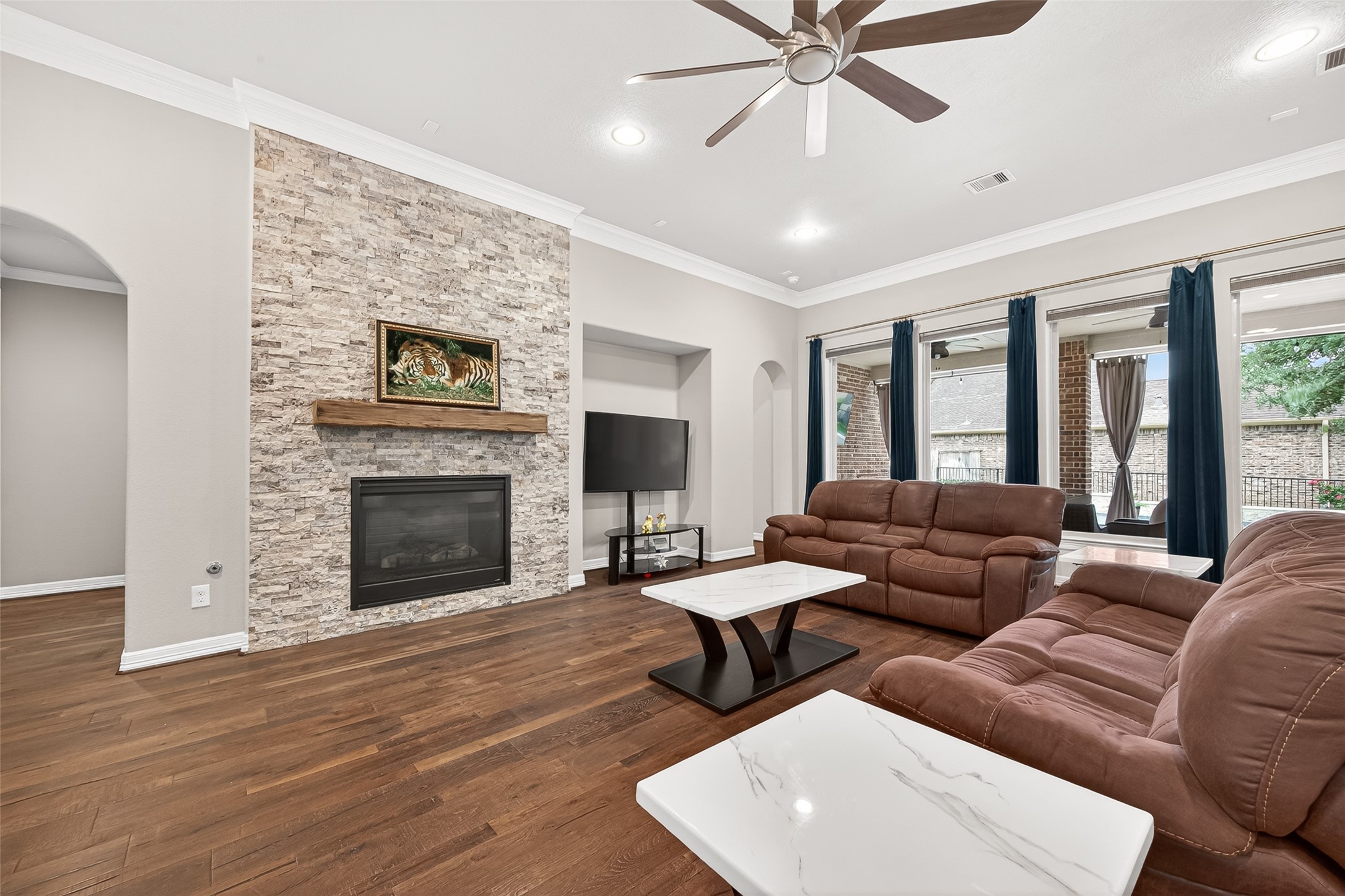 32607 Wingfoot Circle Fulshear, TX 77441 - Photo 10 of 39 Floor to ceiling stone fireplace with lovely mantel to keep you cozy.
