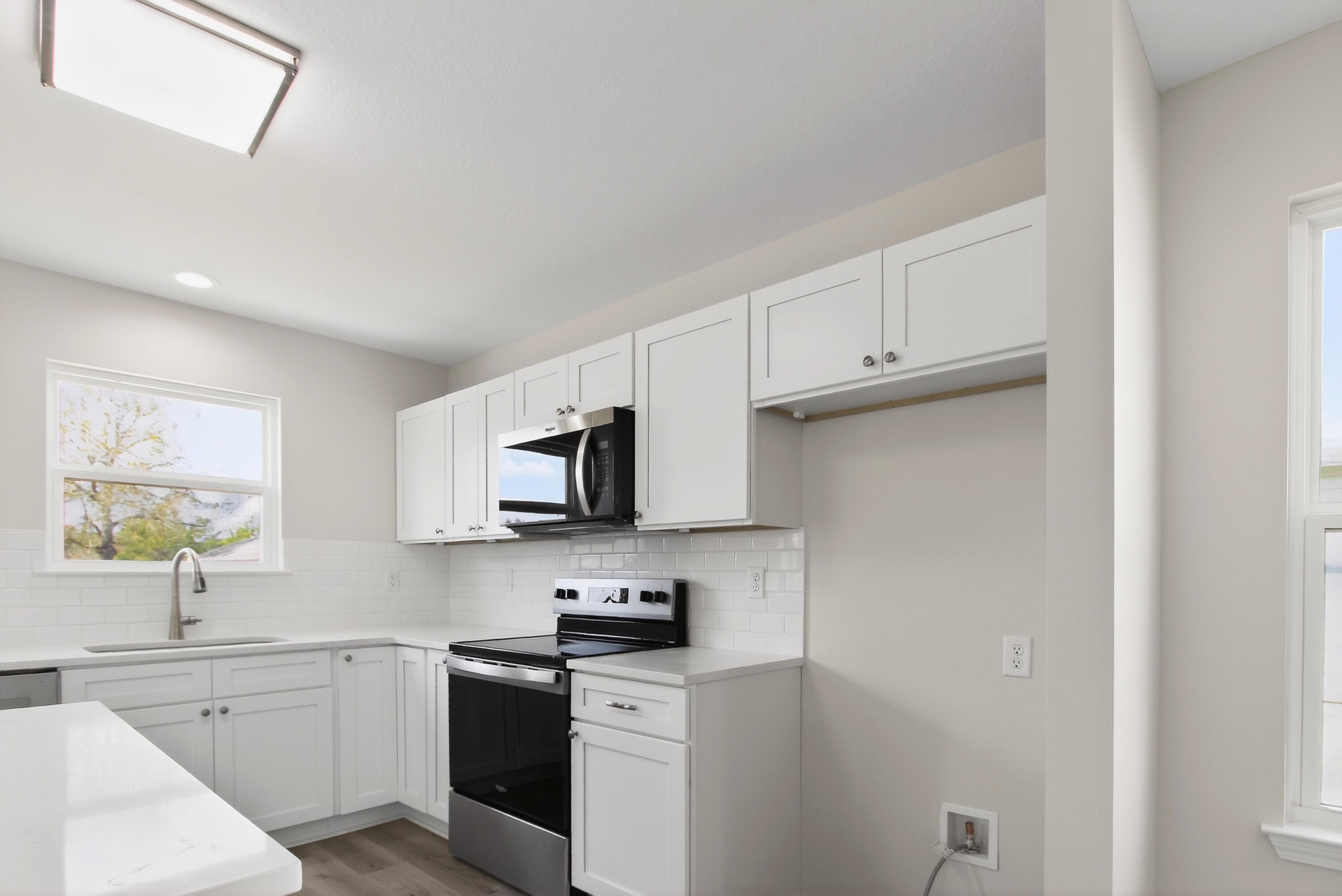 5358 Highview Drive Crestview, FL 32539 - Photo 8 of 31 a kitchen with stainless steel appliances white cabinets a sink and a stove