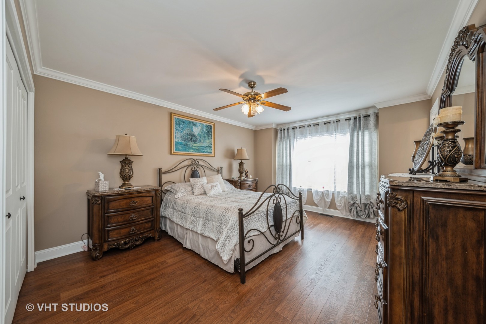 1026 Longford Road Bartlett, IL 60103 - Photo 15 of 24 a spacious bedroom with a bed and a chandelier