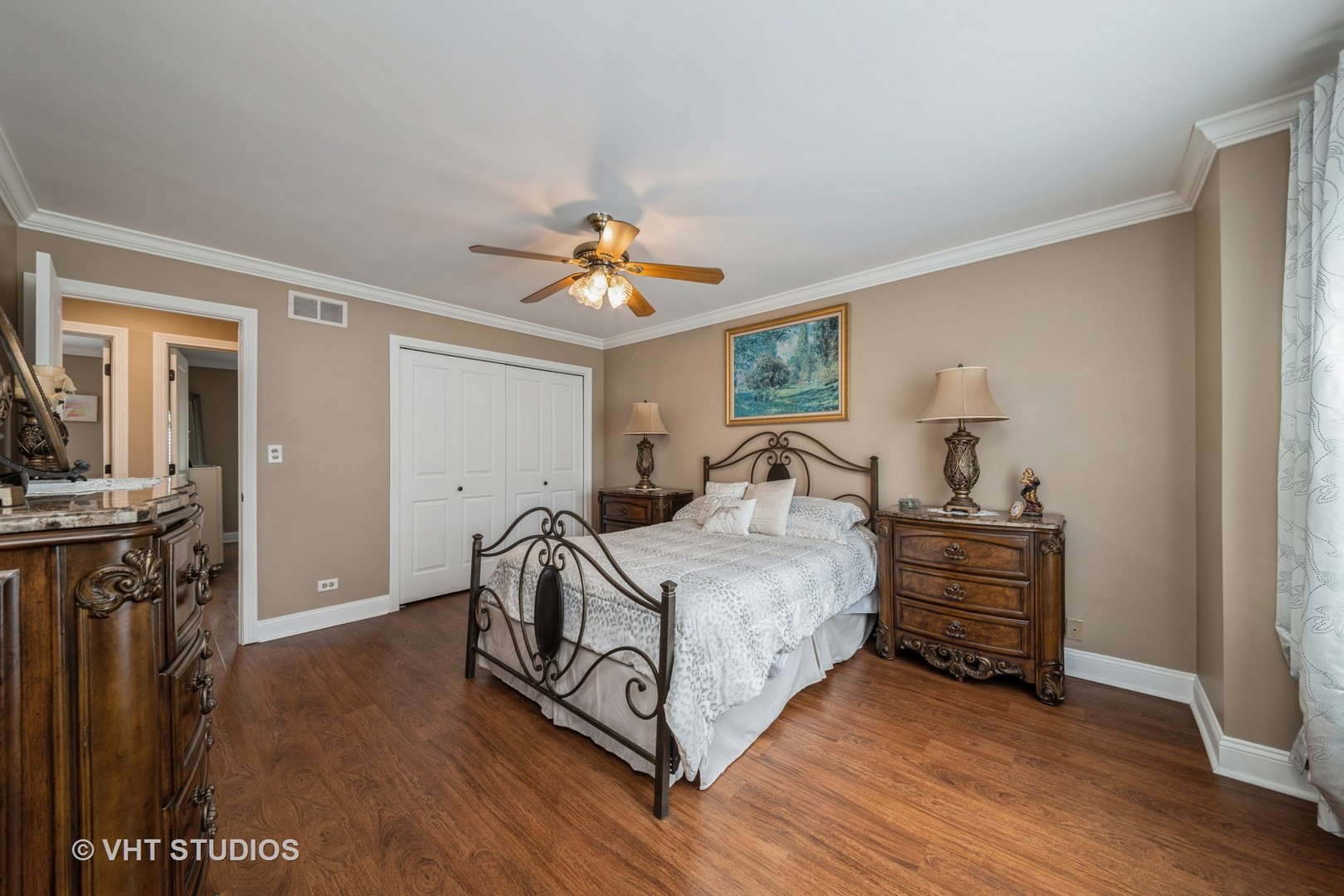 1026 Longford Road Bartlett, IL 60103 - Photo 16 of 24 a bedroom with a bed and a chandelier