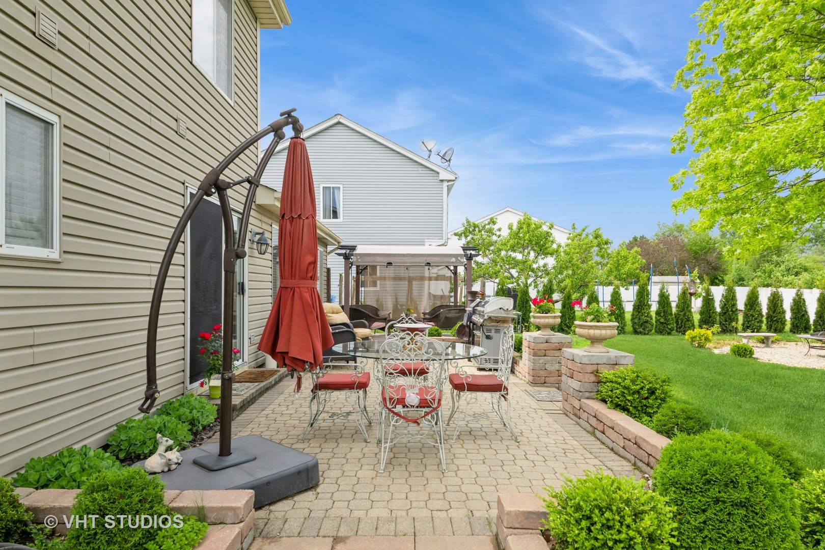 1026 Longford Road Bartlett, IL 60103 - Photo 22 of 24 a view of a chairs and table in backyard of the house