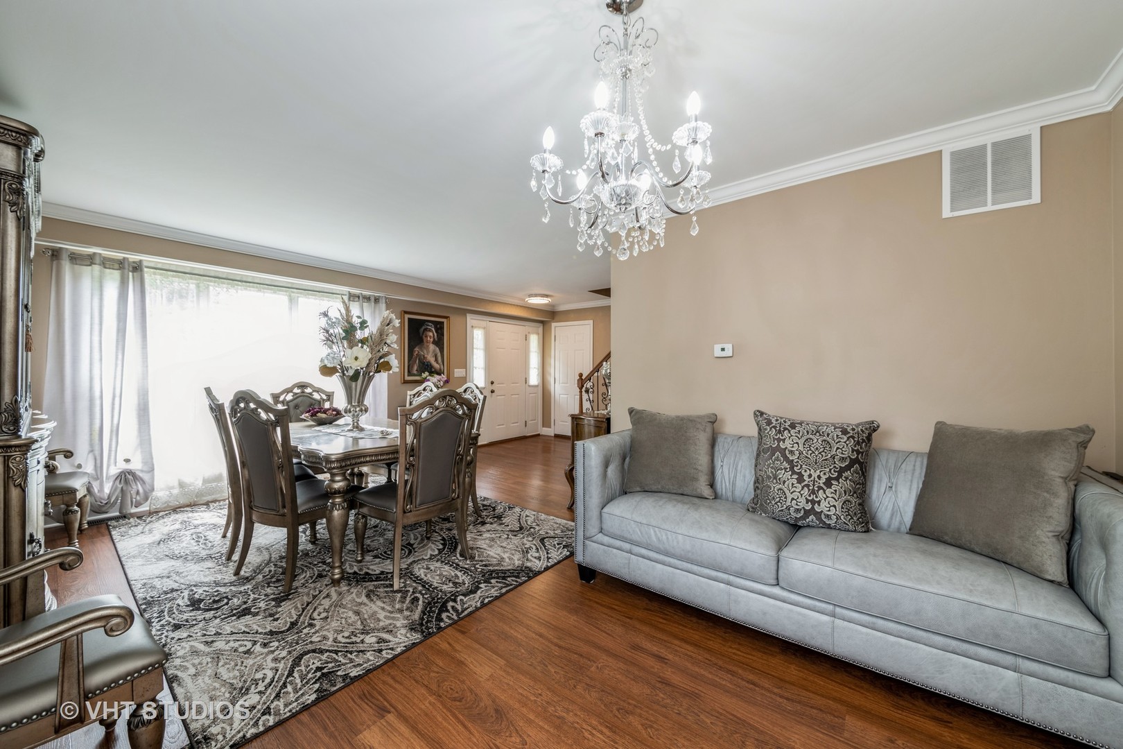 1026 Longford Road Bartlett, IL 60103 - Photo 4 of 24 a living room with furniture and a chandelier