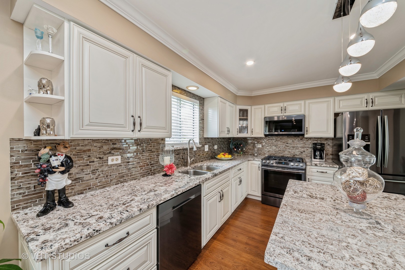 1026 Longford Road Bartlett, IL 60103 - Photo 8 of 24 a kitchen with stainless steel appliances granite countertop sink stove top oven and cabinets
