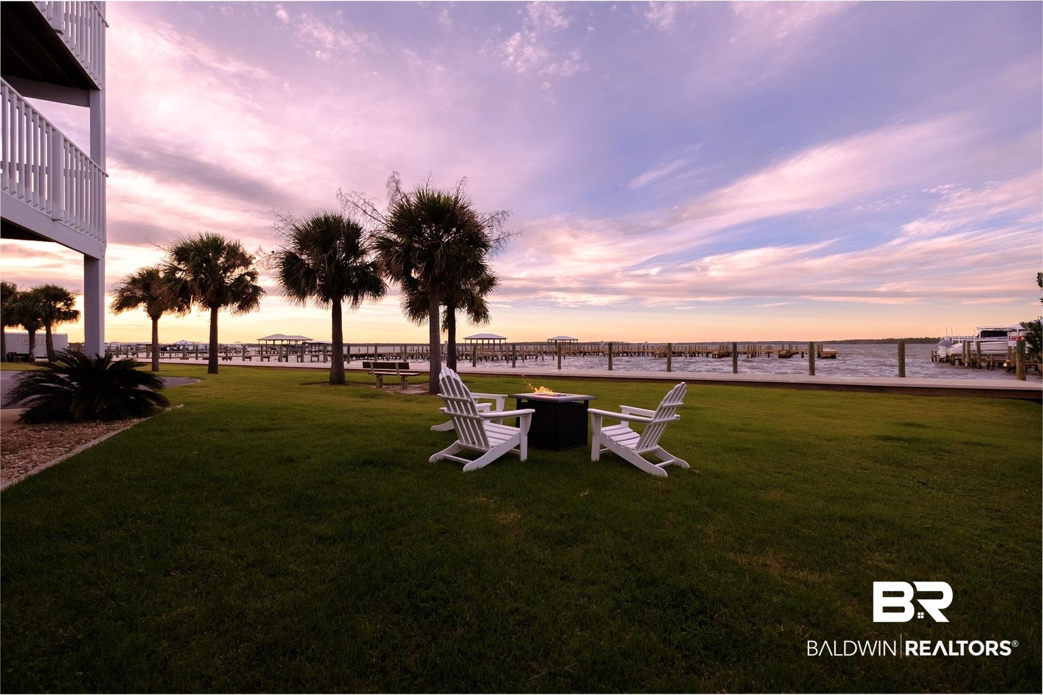 25861 Canal Road, Unit 1 Orange Beach, AL 36561 - Photo 30 of 53 Yard at dusk featuring a water view