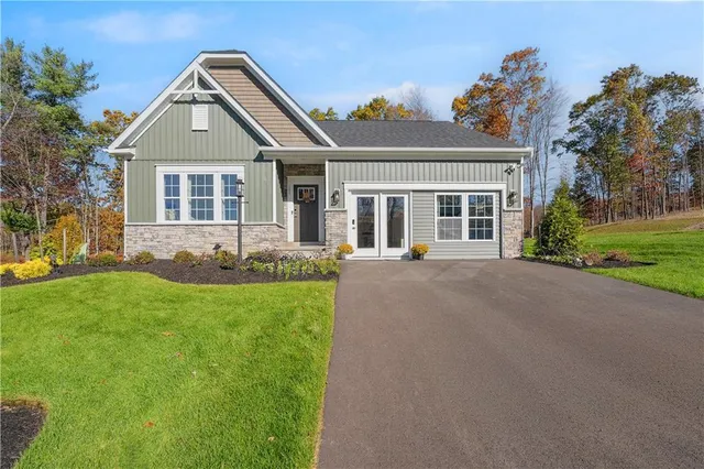 front view of a house with a yard