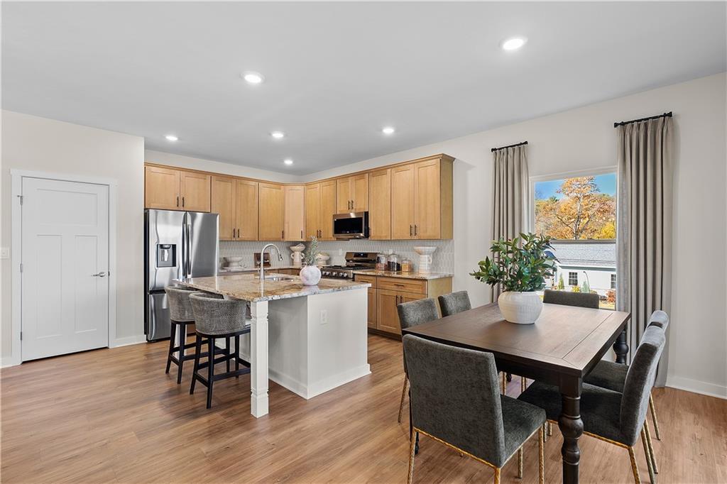 229 Lola Court McKees Rocks, PA 15136 - Photo 11 of 23 a kitchen with a table and chairs in it