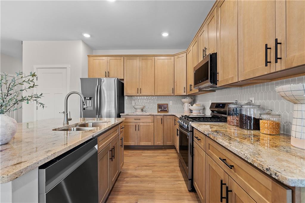 229 Lola Court McKees Rocks, PA 15136 - Photo 13 of 23 a kitchen with a sink a stove and cabinets