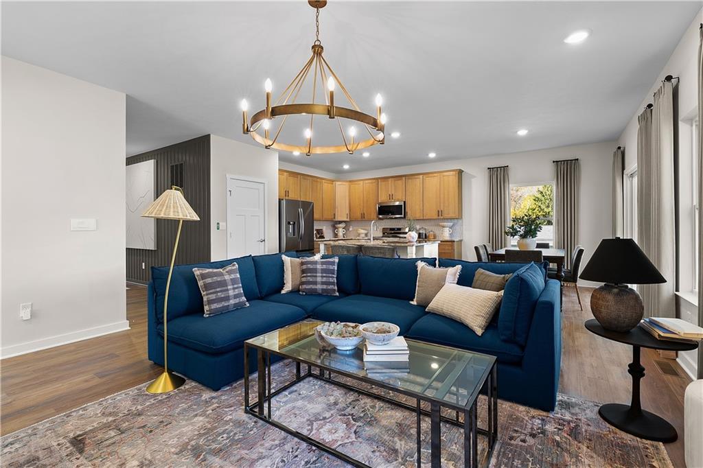 229 Lola Court McKees Rocks, PA 15136 - Photo 17 of 23 a living room with furniture a chandelier and a dining table
