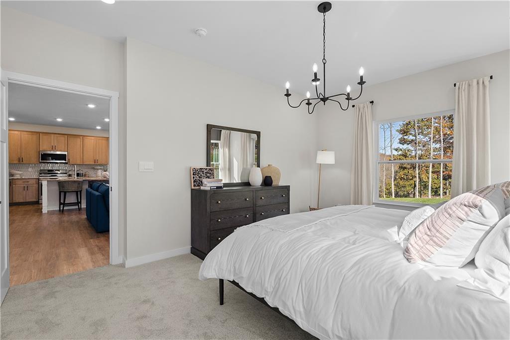 229 Lola Court McKees Rocks, PA 15136 - Photo 19 of 23 a bedroom with a bed chandelier and a window