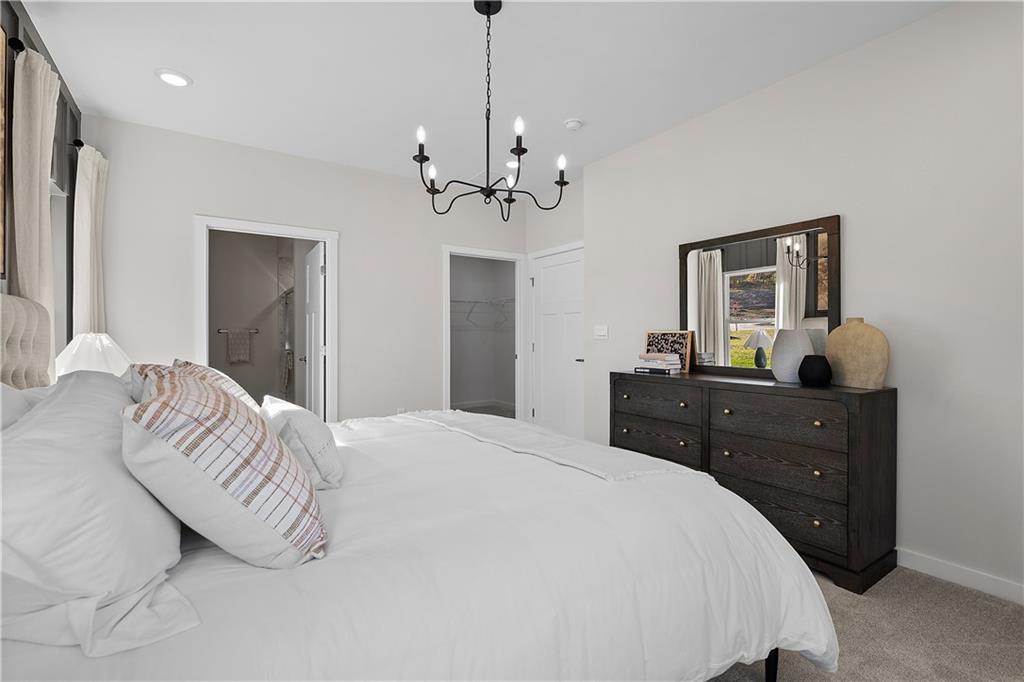 229 Lola Court McKees Rocks, PA 15136 - Photo 21 of 23 a bedroom with a bed and a chandelier