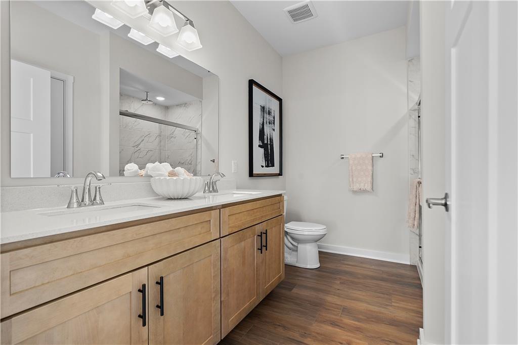 229 Lola Court McKees Rocks, PA 15136 - Photo 22 of 23 a bathroom with a toilet sink and mirror