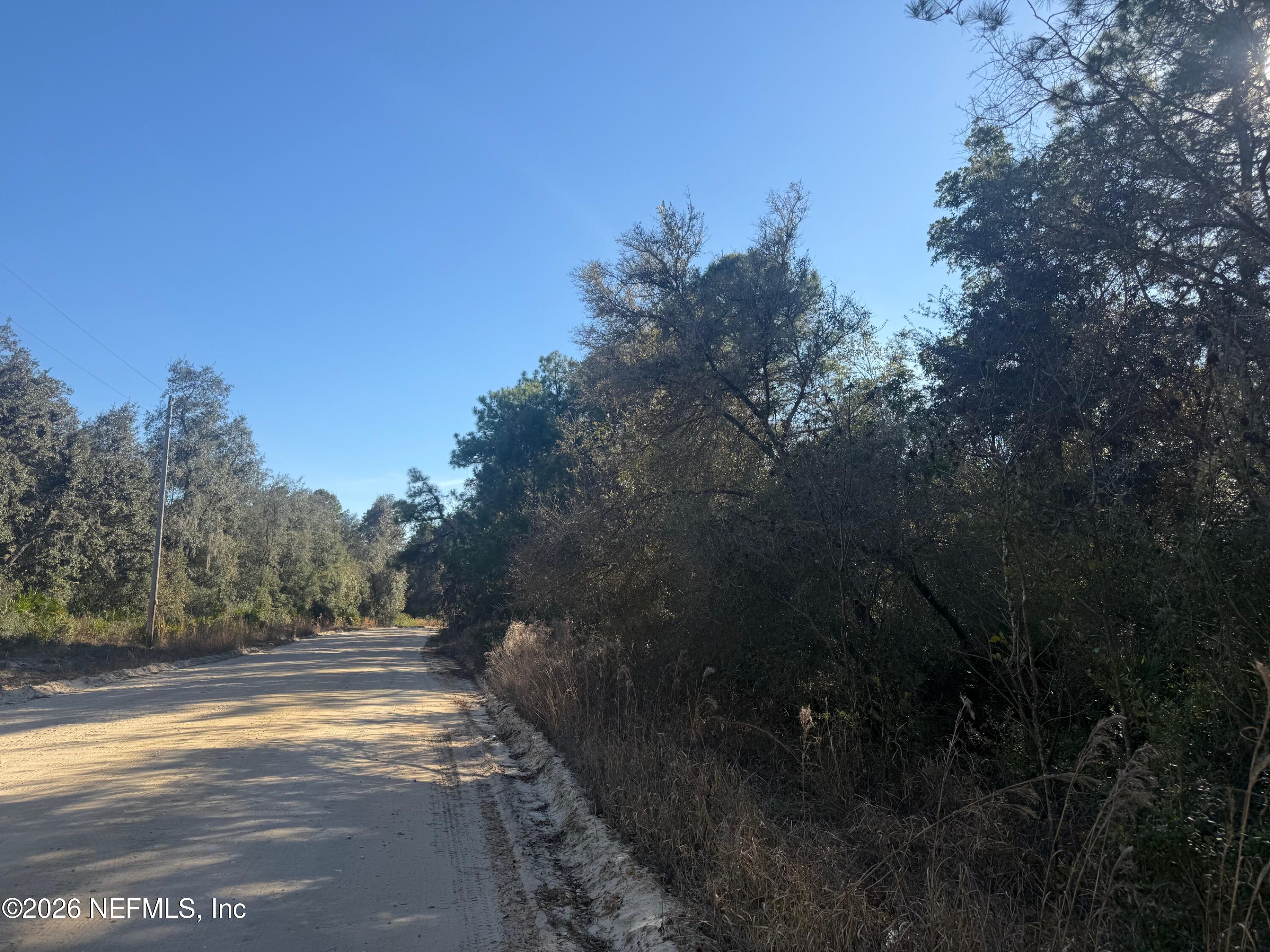 a view of road with trees