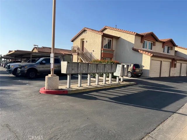 a swimming pool with outdoor seating and yard