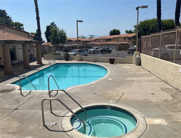 a view of a backyard with a garden and plants