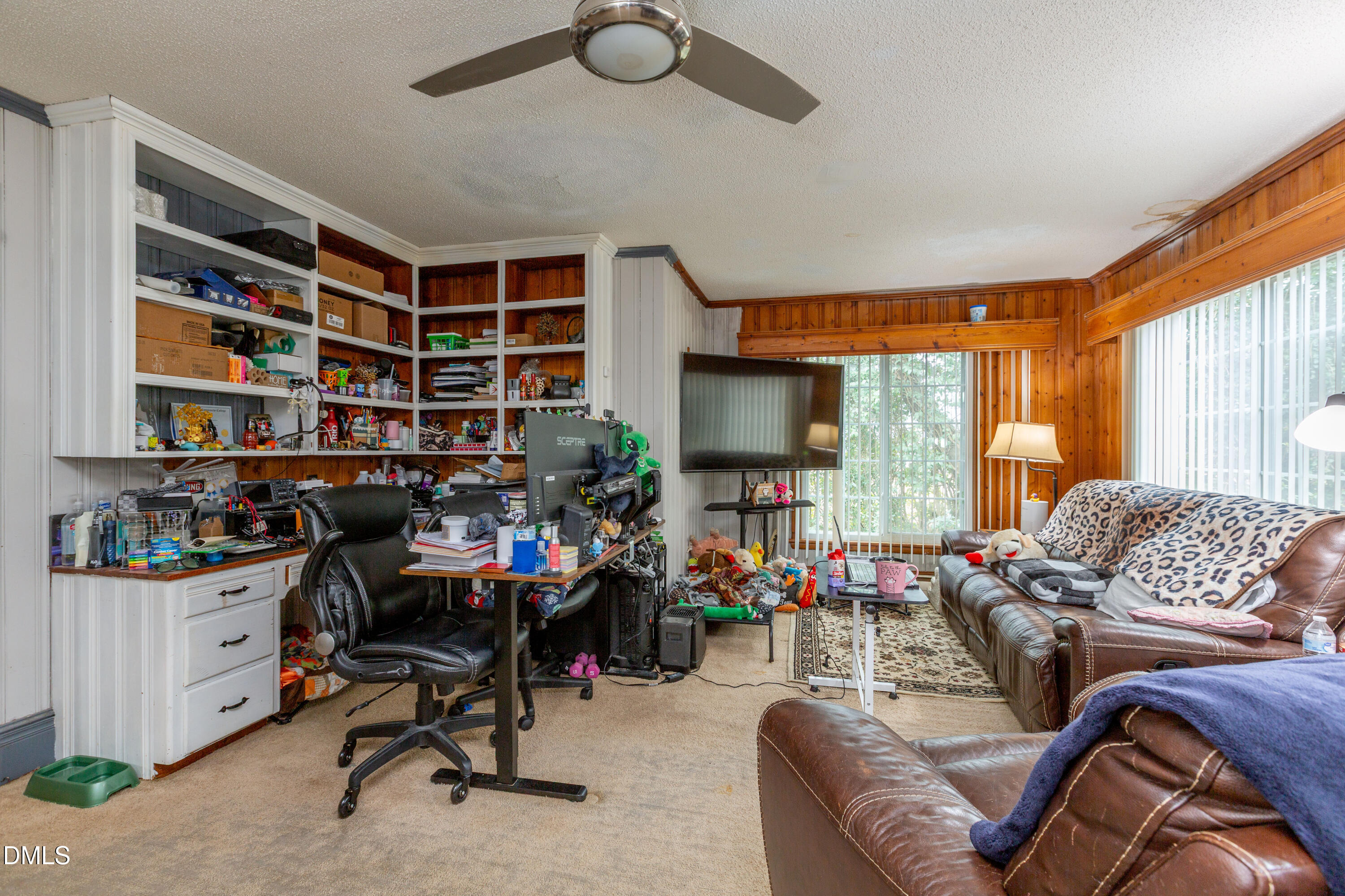 173 Jernigan Road Dunn, NC 28334 - Photo 15 of 42 a living room with furniture a flat screen tv and a window