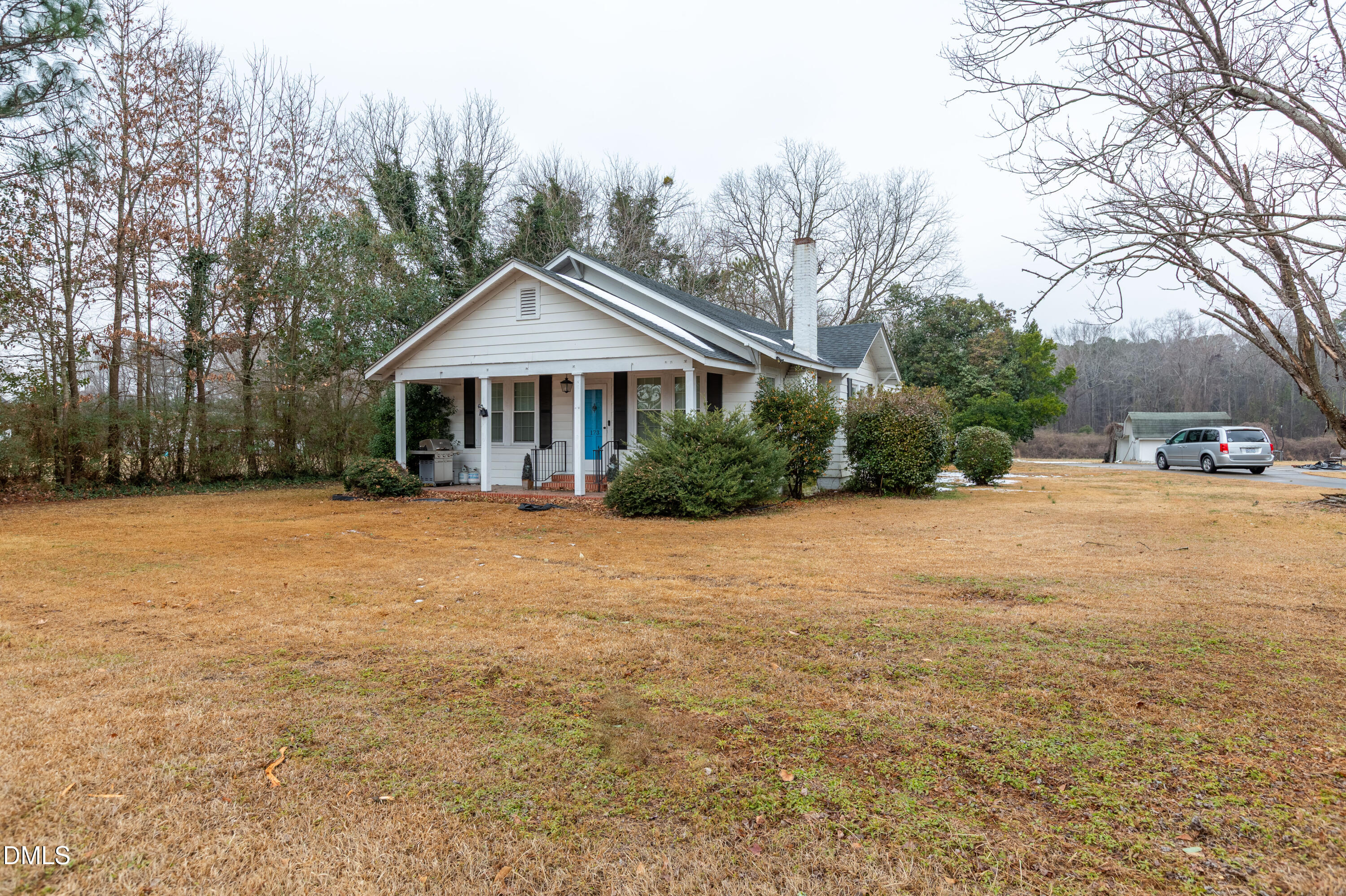 173 Jernigan Road Dunn, NC 28334 - Photo 16 of 42 a front view of a house with a yard and trees