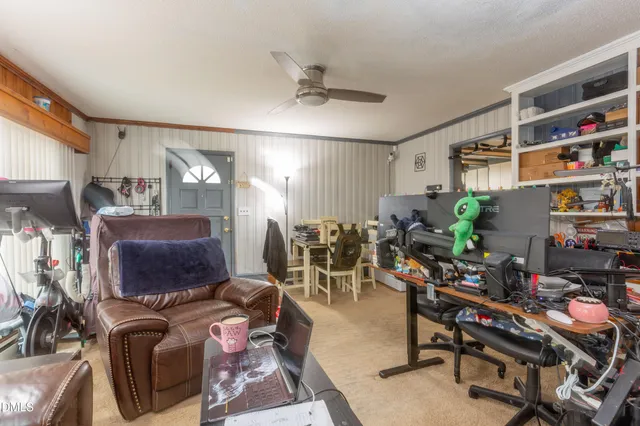 a living room with lots of furniture and a flat screen tv