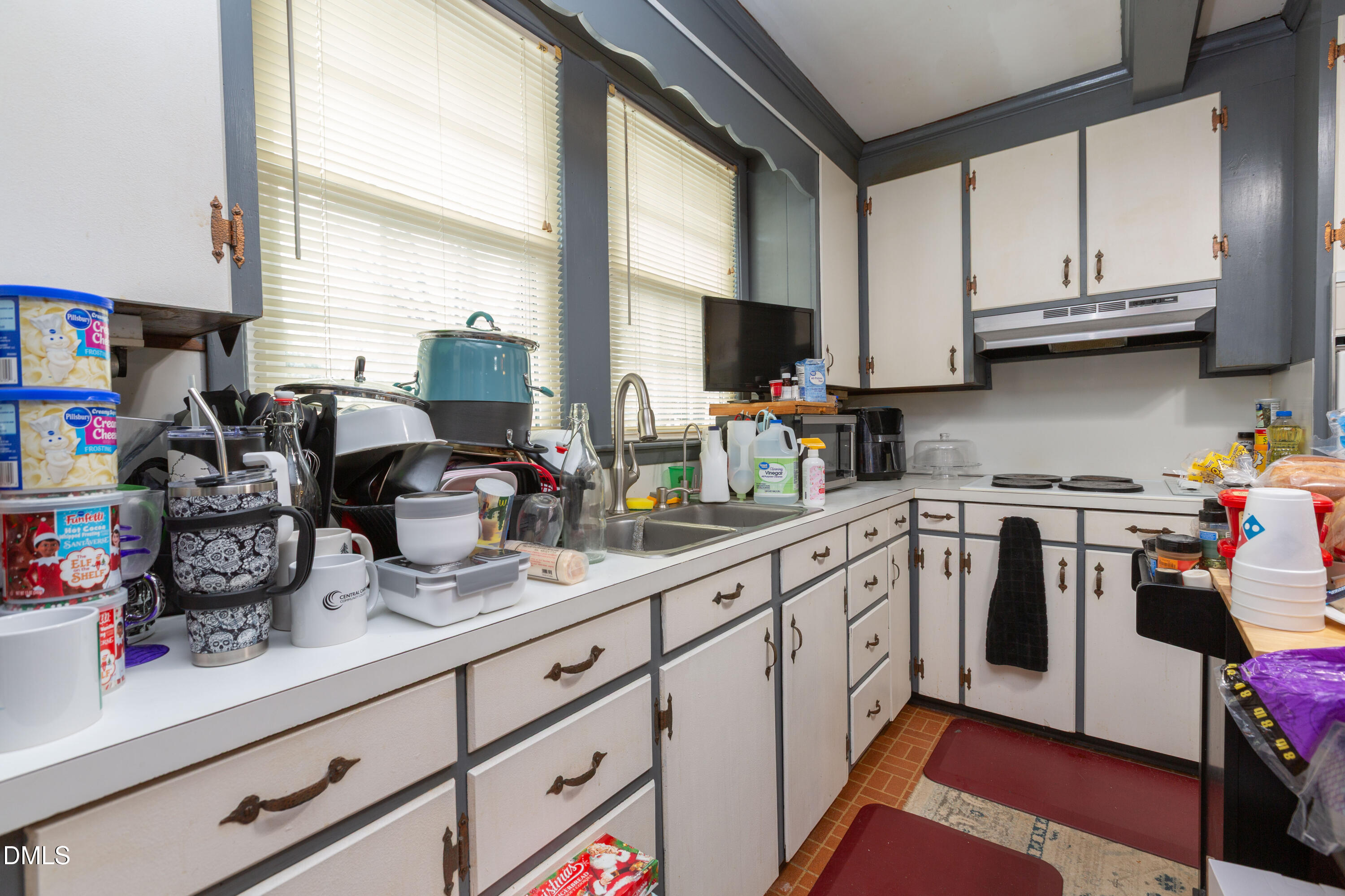 173 Jernigan Road Dunn, NC 28334 - Photo 21 of 42 a kitchen with stainless steel appliances granite countertop a sink a stove and cabinets