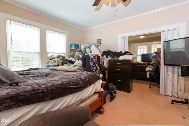 a bed room with furniture and a window