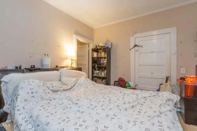 a bedroom with a bed and a cabinets