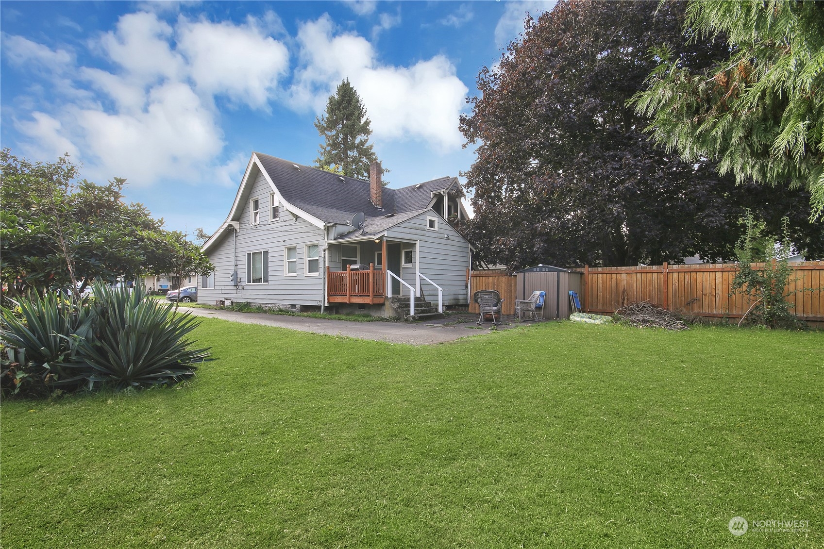 813 West Main Puyallup, WA 98371 - Photo 14 of 24 a view of a house with a yard and sitting area