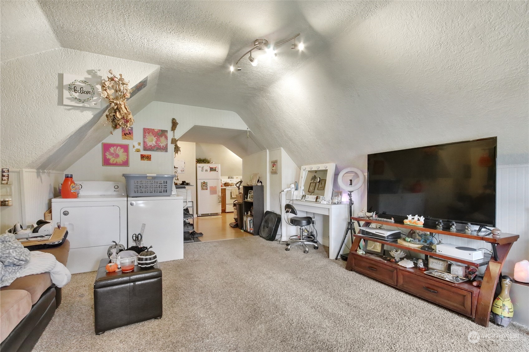 813 West Main Puyallup, WA 98371 - Photo 19 of 24 a living room with furniture and a flat screen tv