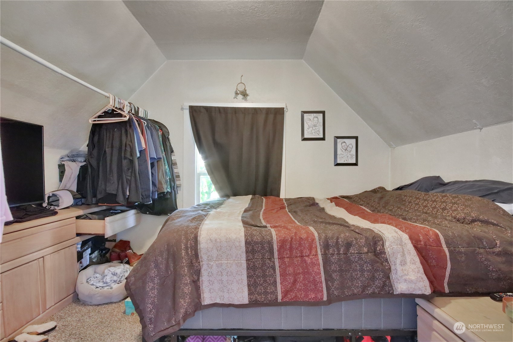 813 West Main Puyallup, WA 98371 - Photo 20 of 24 a bedroom with a bed and a flat tv screen