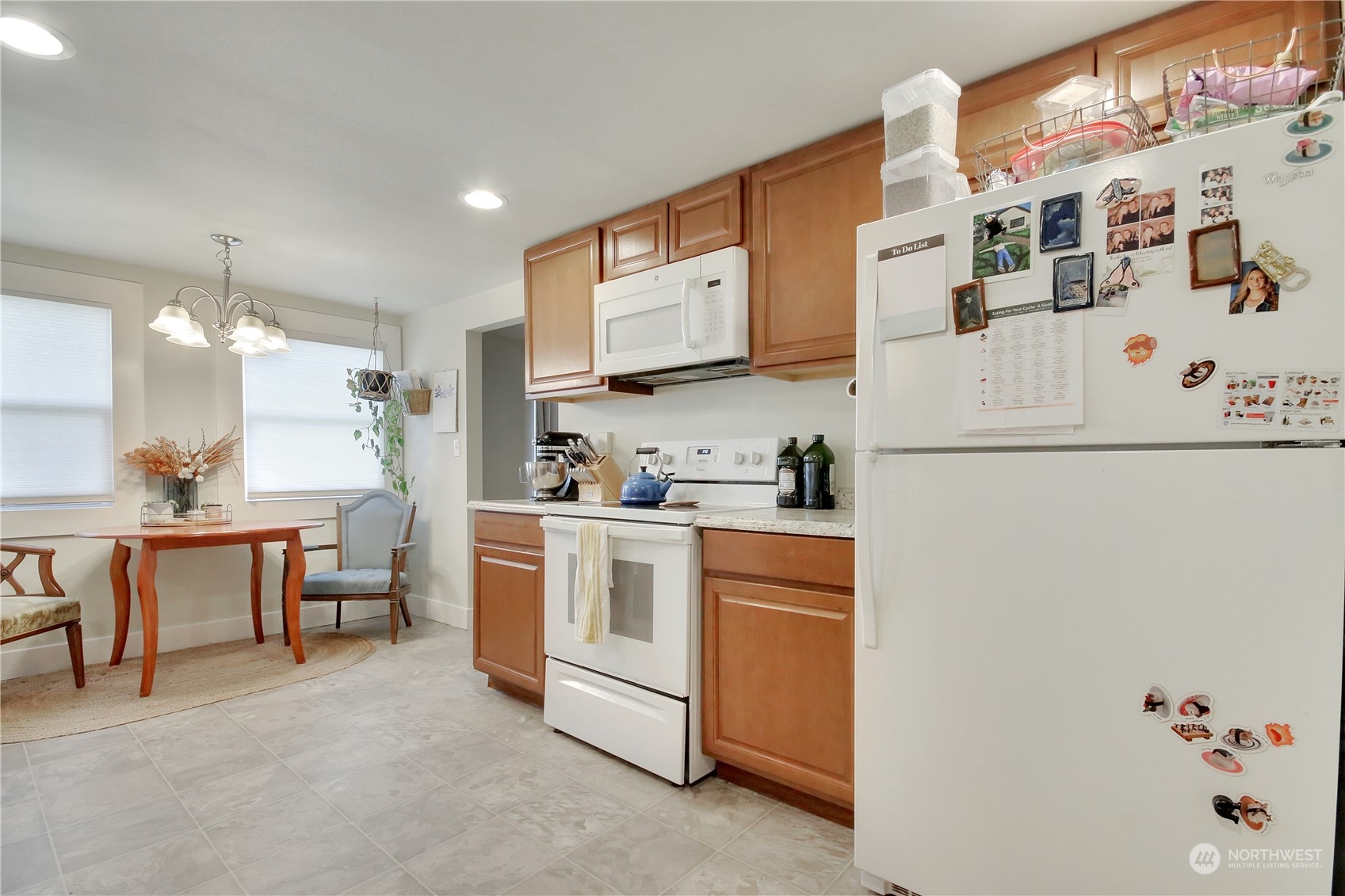 813 West Main Puyallup, WA 98371 - Photo 8 of 24 a kitchen with white cabinets and white appliances