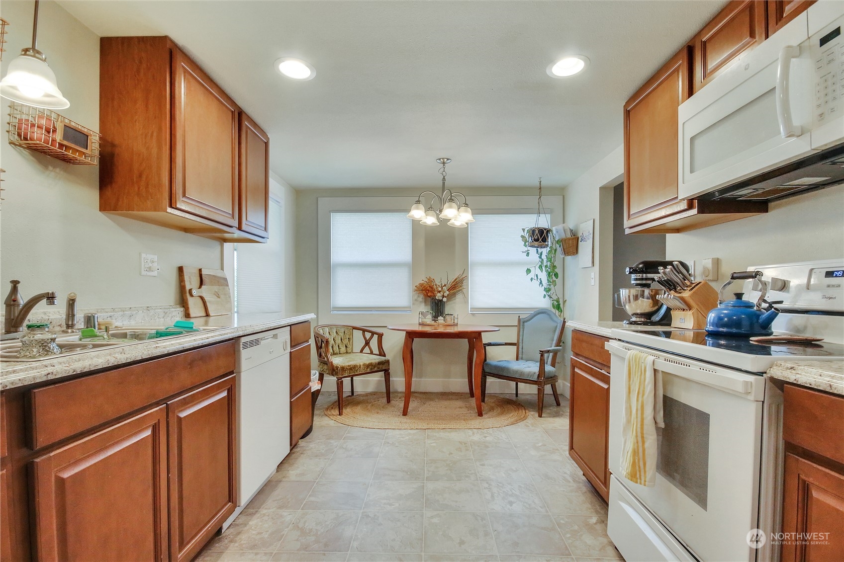 813 West Main Puyallup, WA 98371 - Photo 9 of 24 a kitchen with stainless steel appliances granite countertop a sink dishwasher stove and cabinets