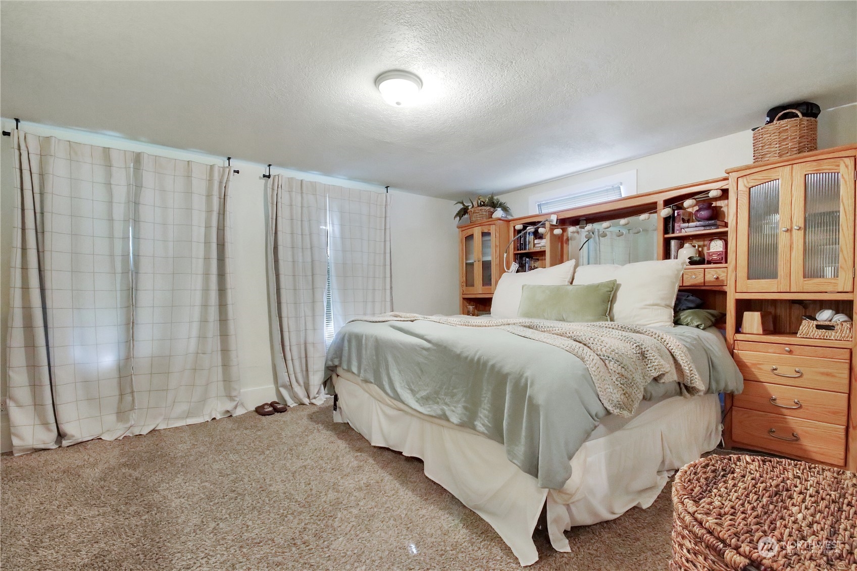 813 West Main Puyallup, WA 98371 - Photo 10 of 24 a bedroom with a bed and a window