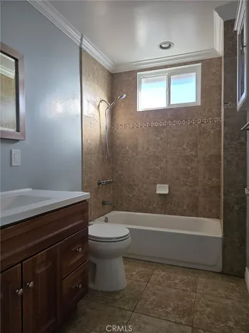 a bathroom with a toilet a sink and bathtub
