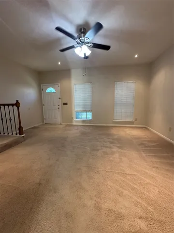 a view of a livingroom with a ceiling fan