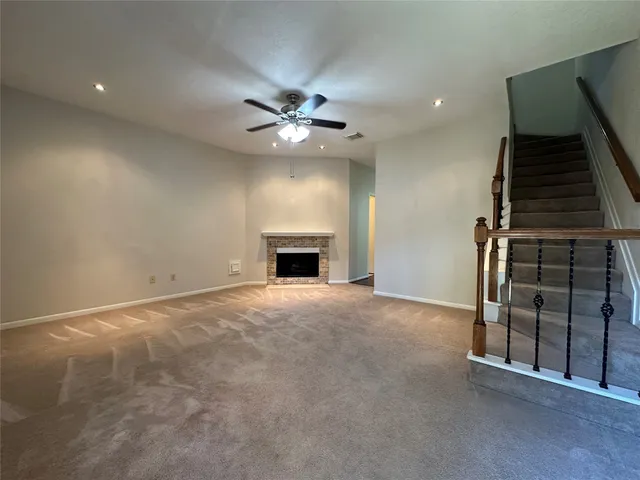 wooden floor in an empty room with a fireplace