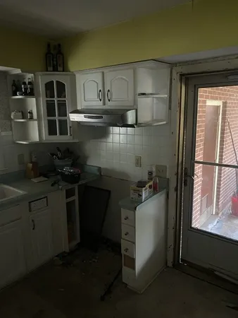 a kitchen with a sink and cabinets