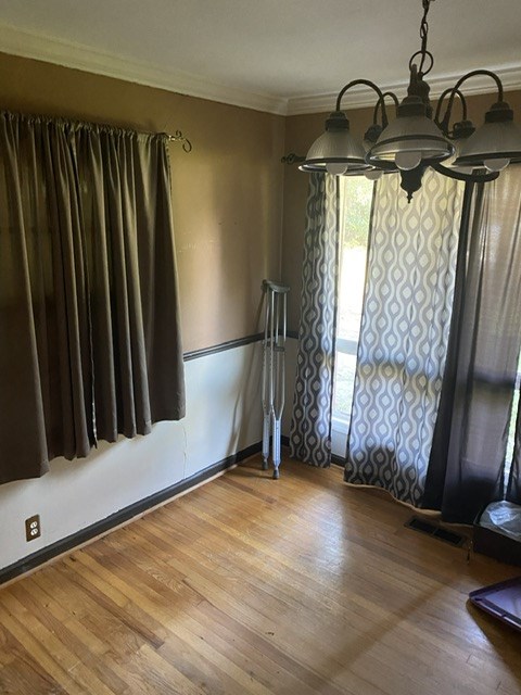 4923 Hall Avenue Columbus, GA 31909 - Photo 4 of 4 a view of a room with wooden floor and windows