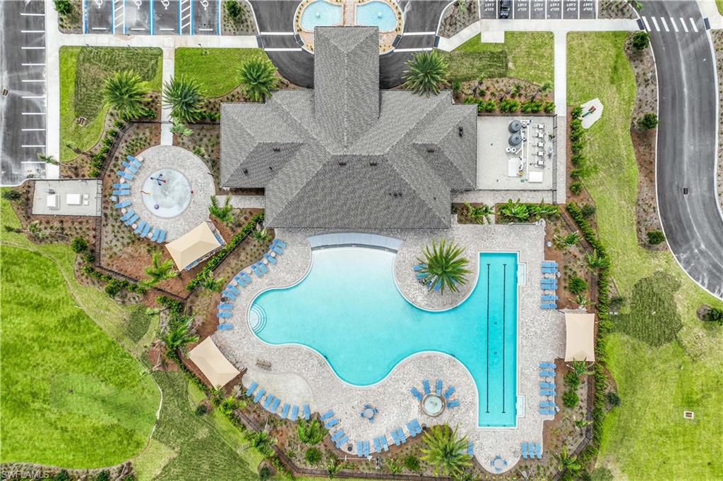 17911 Shade Tree Loop Babcock Ranch, FL 33982 - Photo 42 of 44 an aerial view of a swimming pool patio and outdoor seating