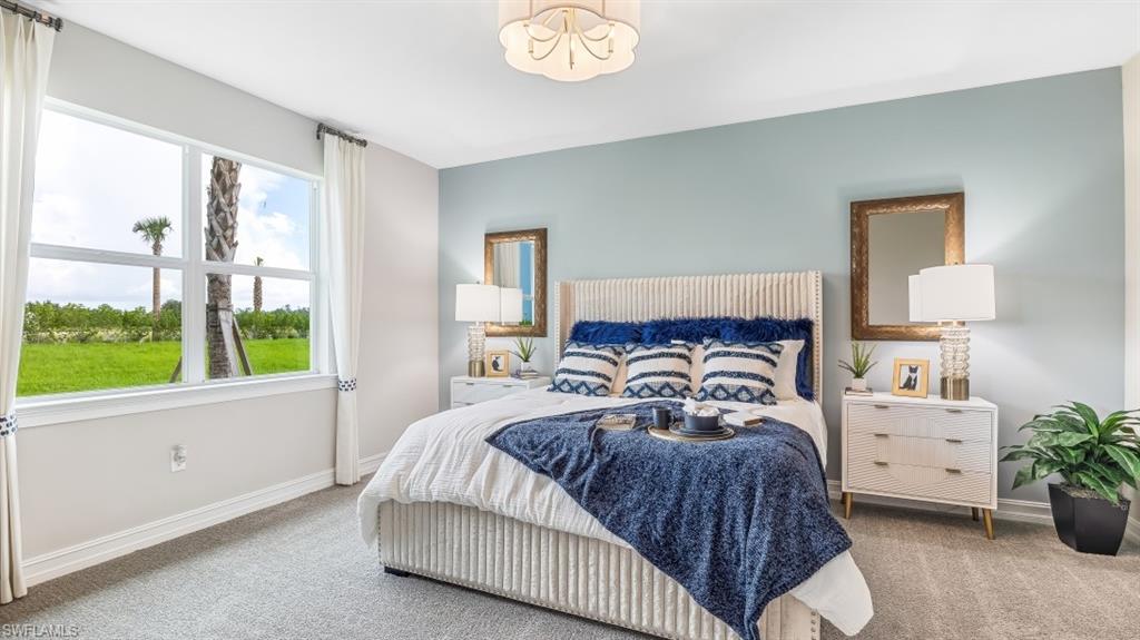 17911 Shade Tree Loop Babcock Ranch, FL 33982 - Photo 10 of 44 a bedroom with a bed and a window