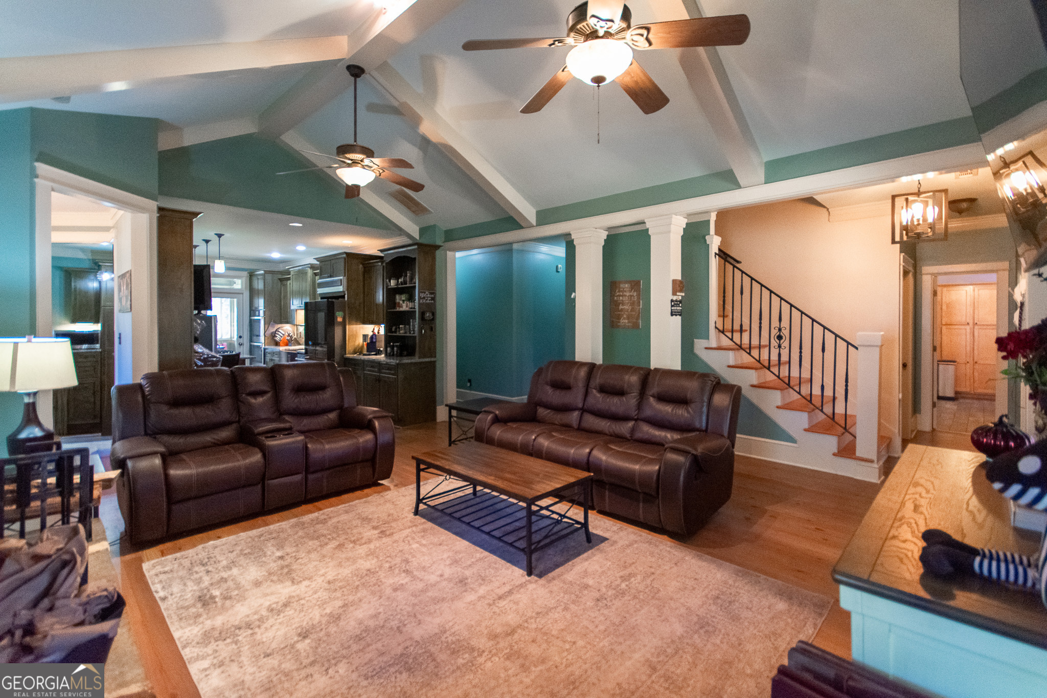 190 Carl Williams Road Senoia, GA 30276 - Photo 18 of 93 a living room with furniture and a chandelier