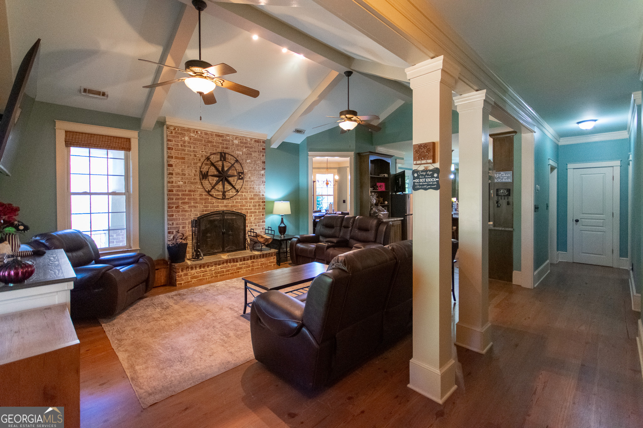 190 Carl Williams Road Senoia, GA 30276 - Photo 19 of 93 a living room with furniture and a chandelier