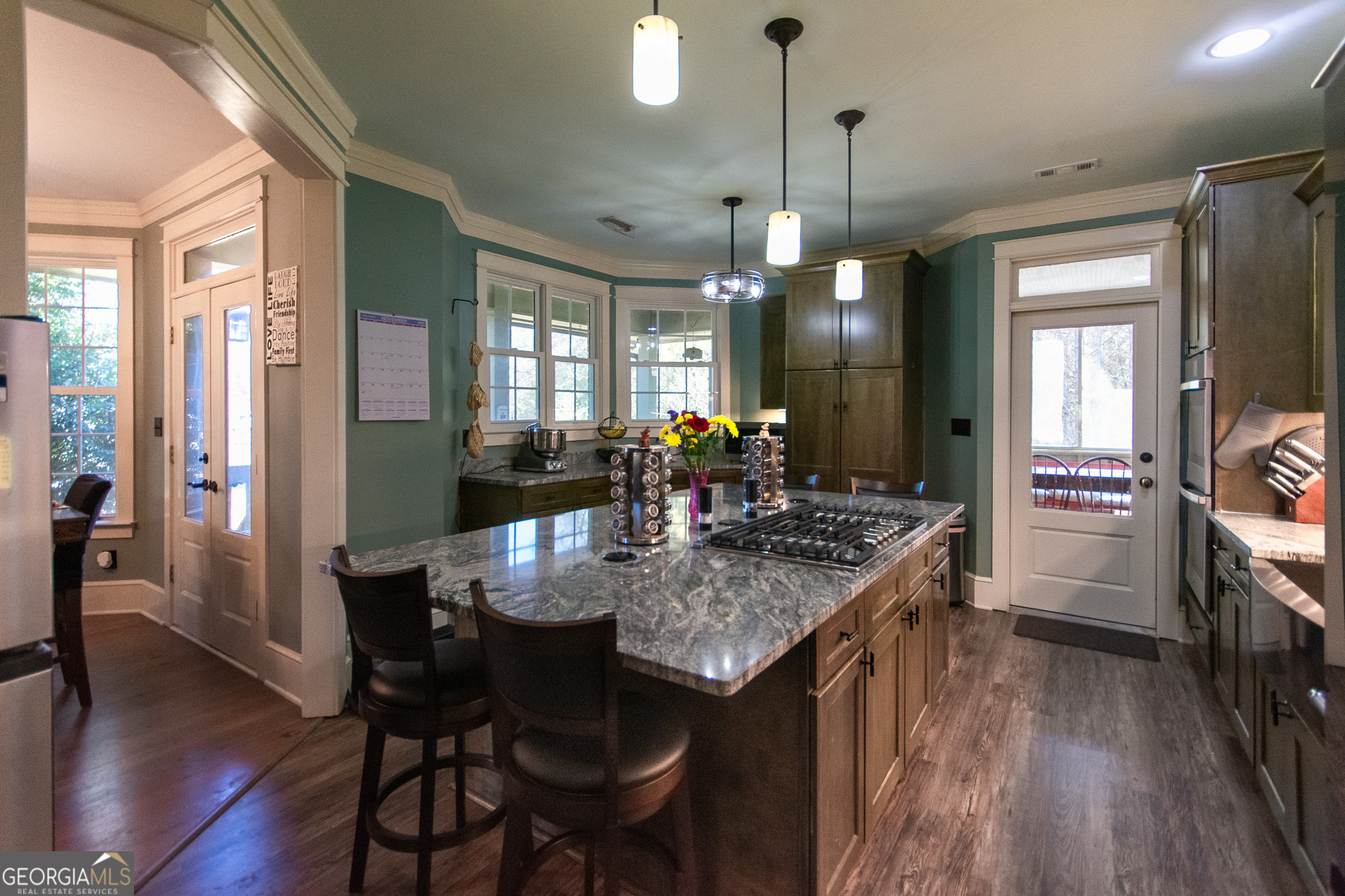 190 Carl Williams Road Senoia, GA 30276 - Photo 24 of 93 a kitchen that has a table chairs and wooden floor