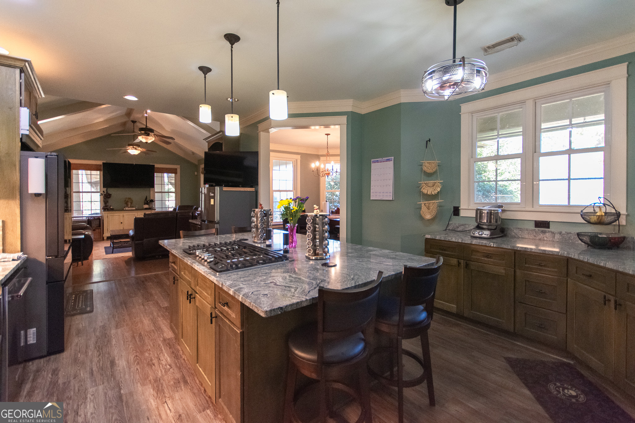 190 Carl Williams Road Senoia, GA 30276 - Photo 25 of 93 a kitchen that has a table chairs in it and wooden floors