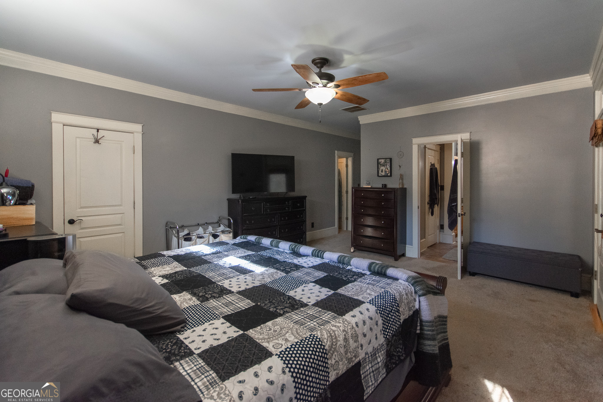 190 Carl Williams Road Senoia, GA 30276 - Photo 31 of 93 a bedroom with a bed and a flat screen tv