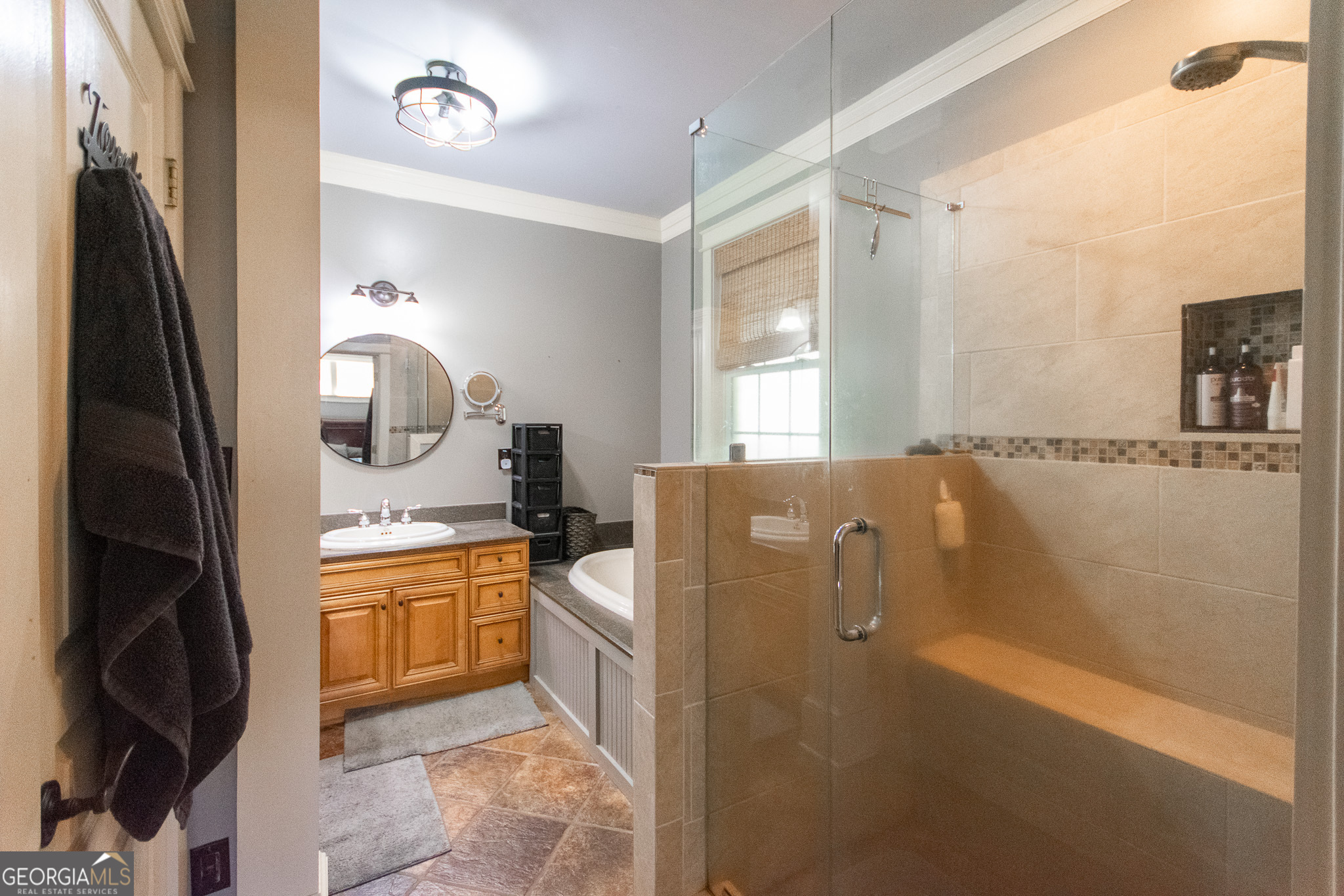 190 Carl Williams Road Senoia, GA 30276 - Photo 32 of 93 a spacious bathroom with a granite countertop sink mirror and bathtub