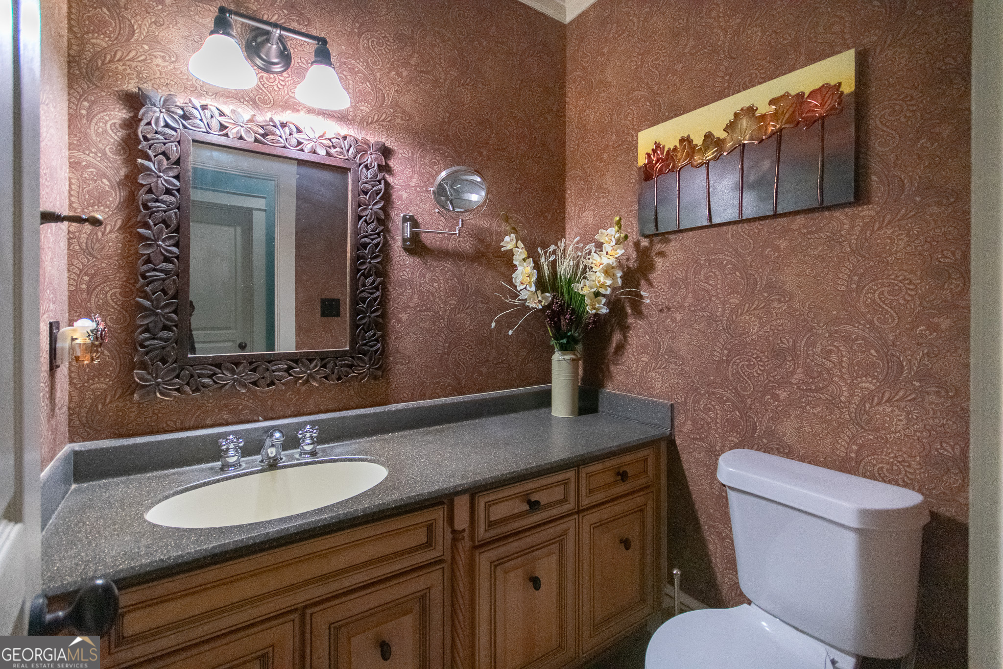 190 Carl Williams Road Senoia, GA 30276 - Photo 38 of 93 a bathroom with a toilet sink and mirror